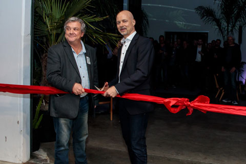 Larry Italia, president/CEO of d&b audiotechnik Americas and Amnon Harman, d&b CEO, take part in the ribbon-cutting ceremony