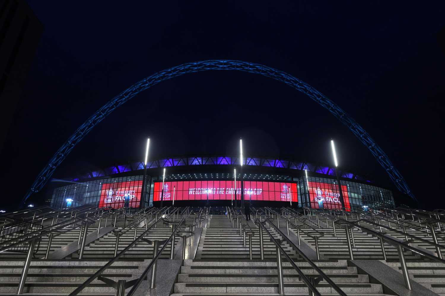 The giant LED screens dominate the stadium entrance The giant LED screens dominate the stadium entrance